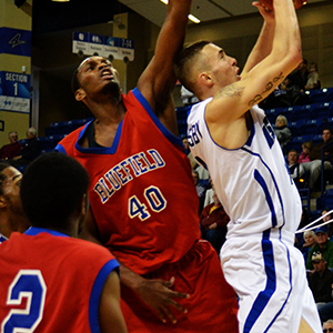 Ashville's Keith Hornsby tries to get around Byron Carpenter (40)